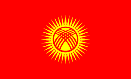 The flag of Kyrgyzstan features a yellow sun with forty rays at the center of a red field. At the center of the sun is a stylized depiction of a tunduk.